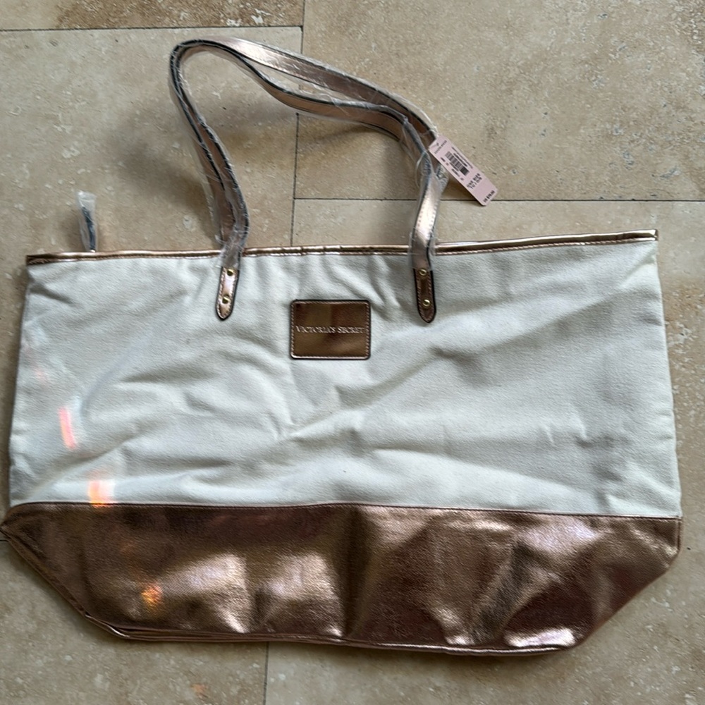 Victoria’s Secret cotton canvas tote with bronze metallic accents. NWT.